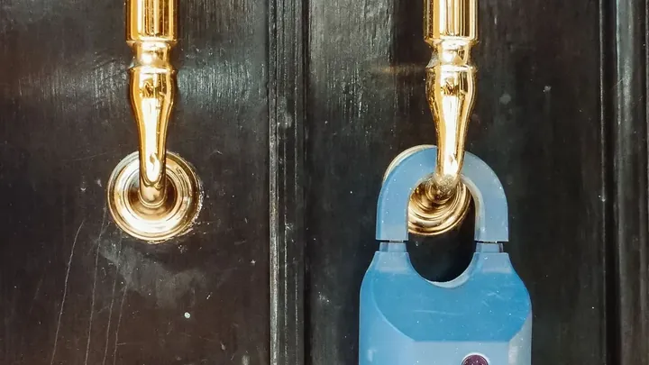 A row of terraced front doors on a residential street