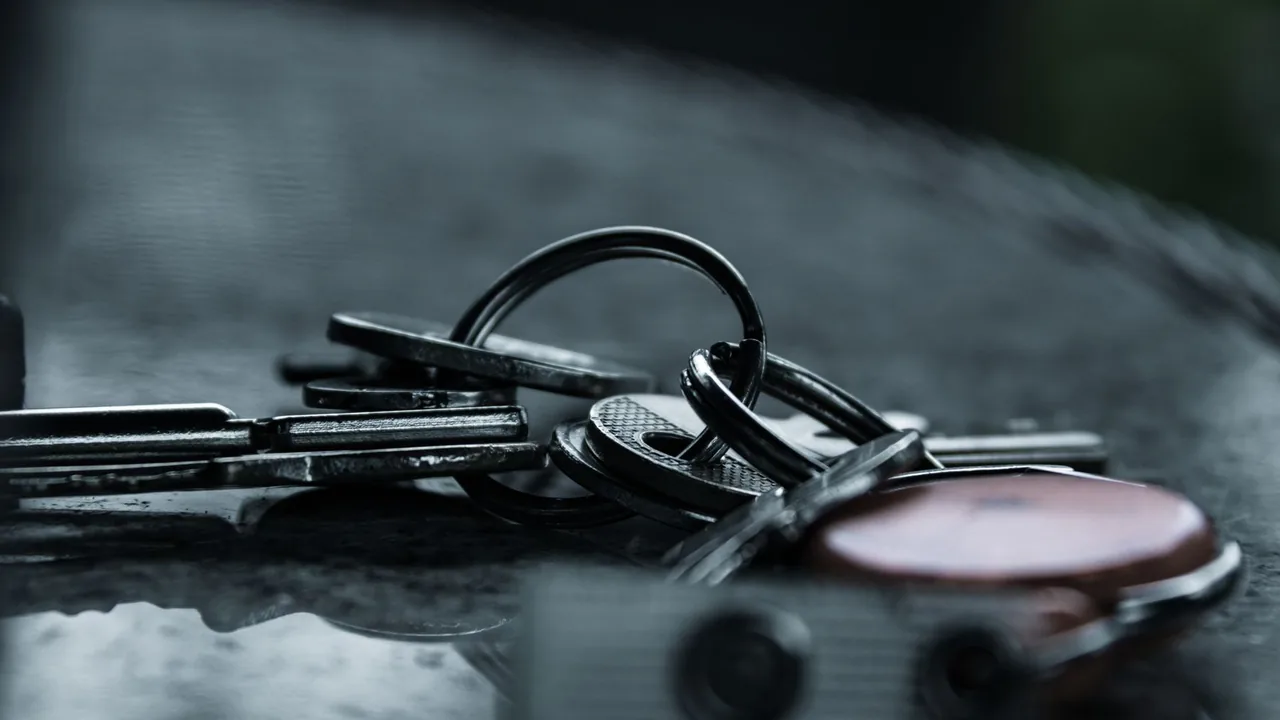 An address and a handle are keys: a service can be asked whether it holds one. A name is not a key, and that is the whole difference.
