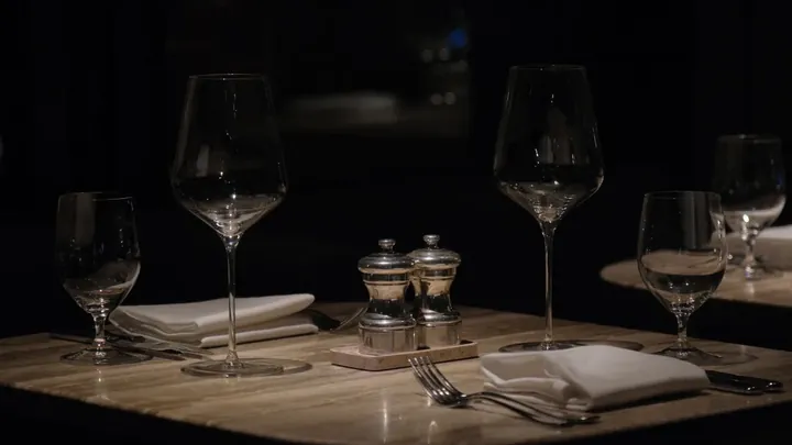 An empty restaurant table set for two