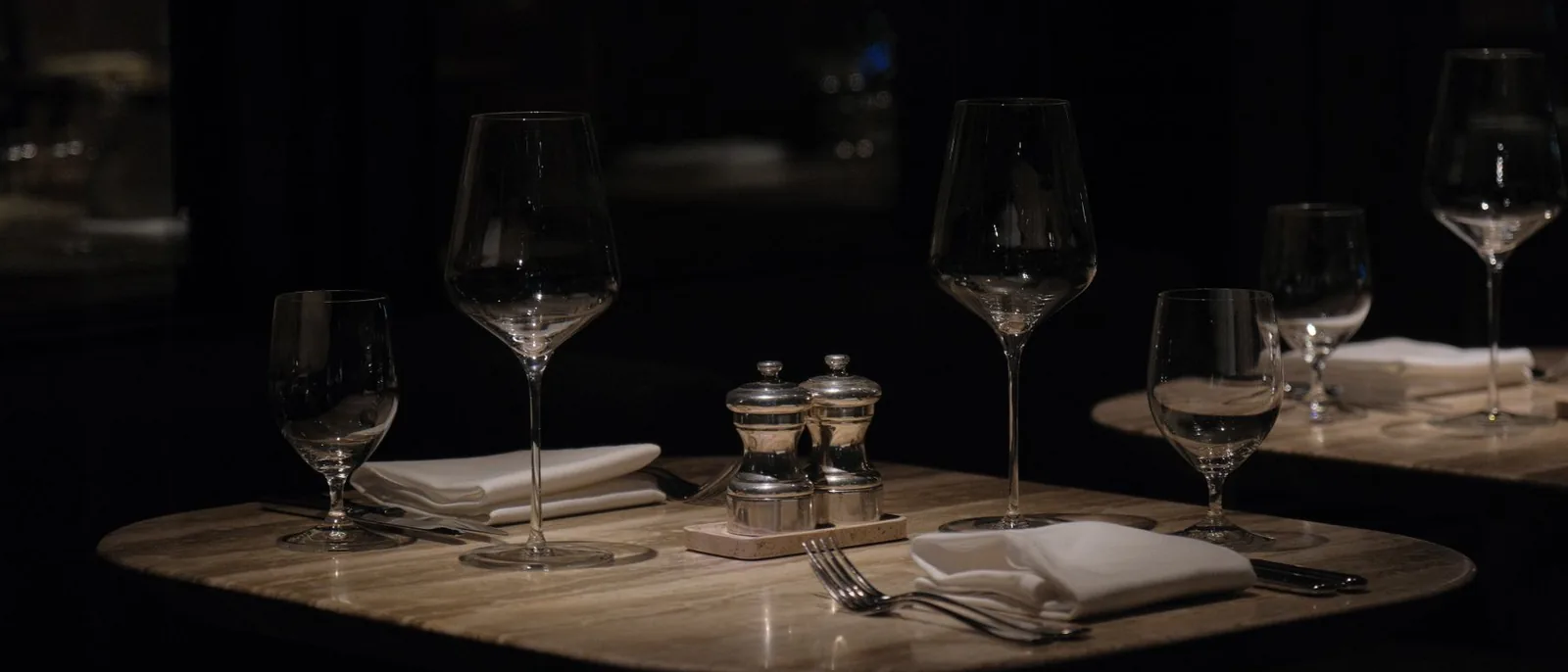 An empty restaurant table set for two