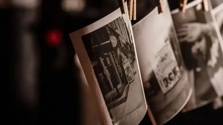 A photograph held in a hand