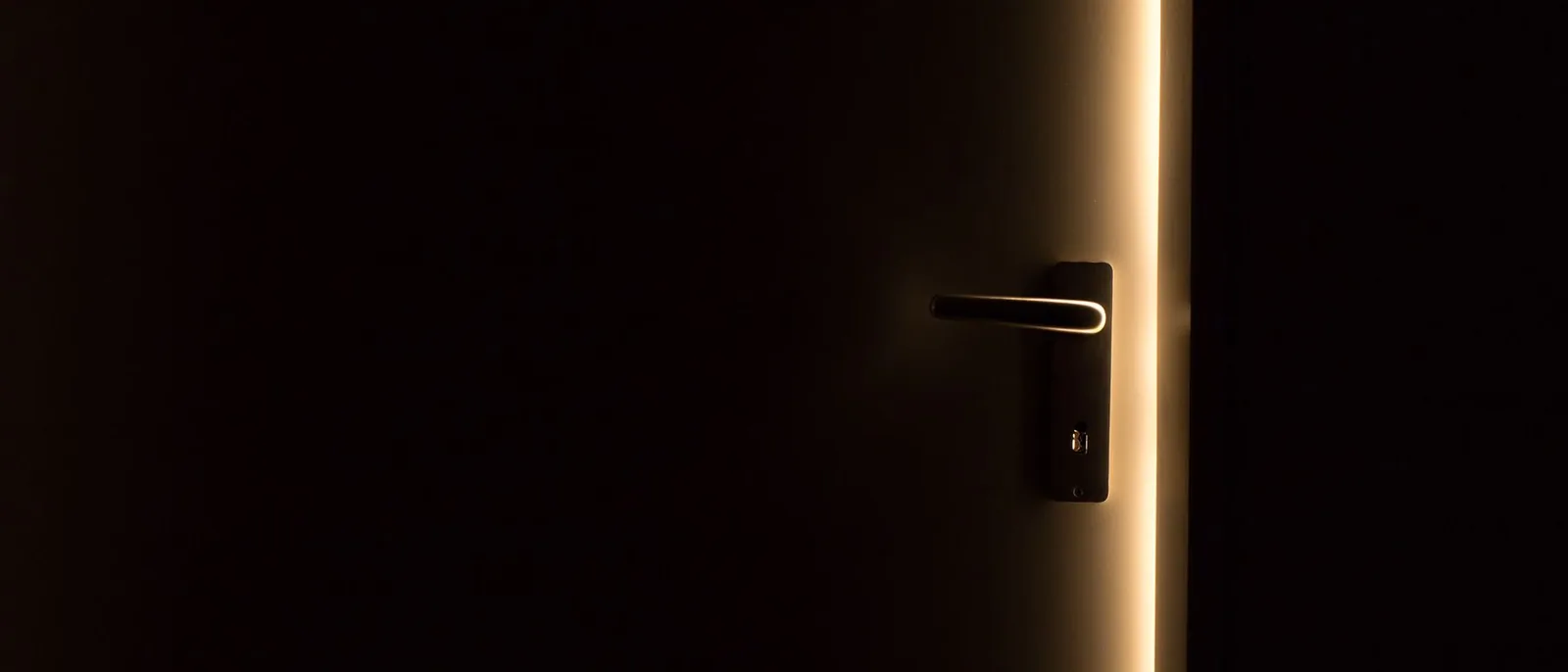 A phone screen lit in a dark room