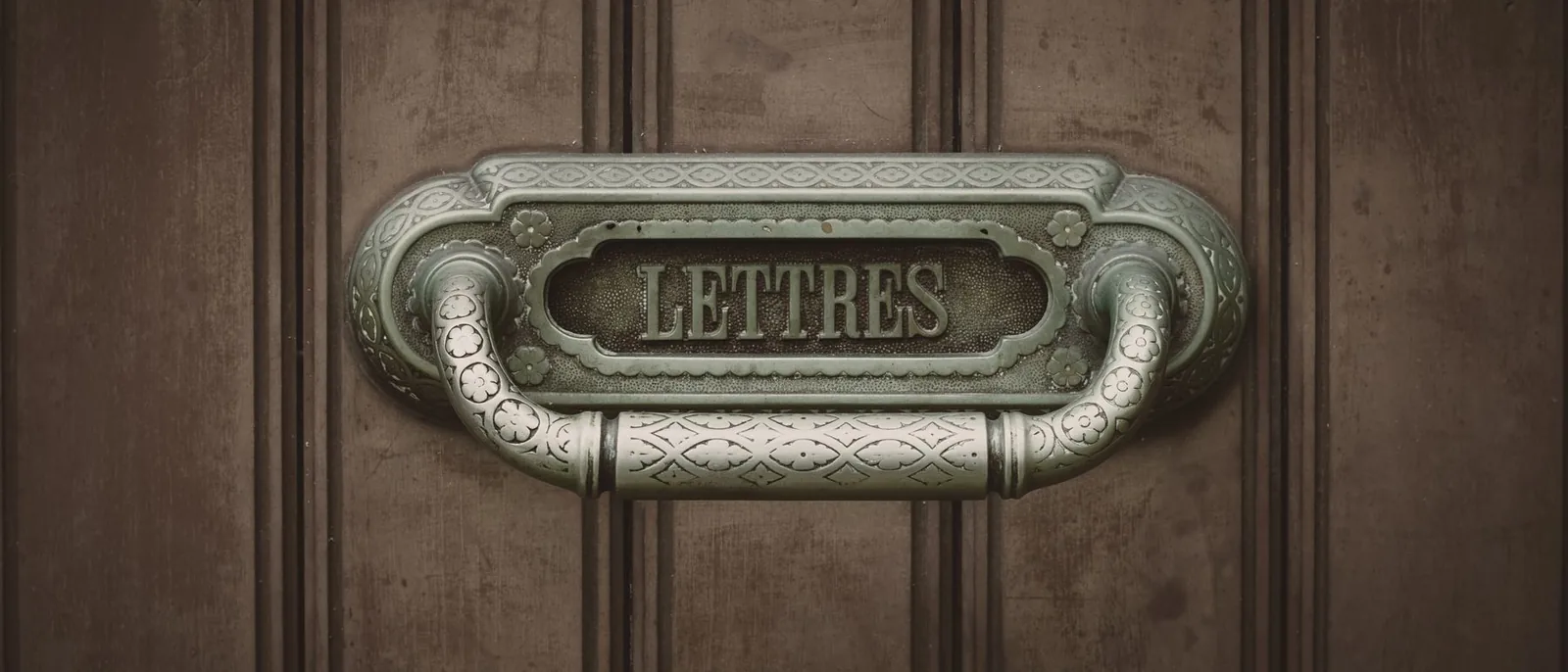 A brass nameplate on a door